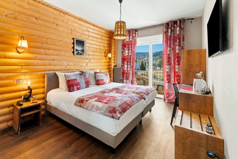 Twin room with lake view, two adjoining beds, chalet-style decor and balcony, La Réserve Gérardmer hotel